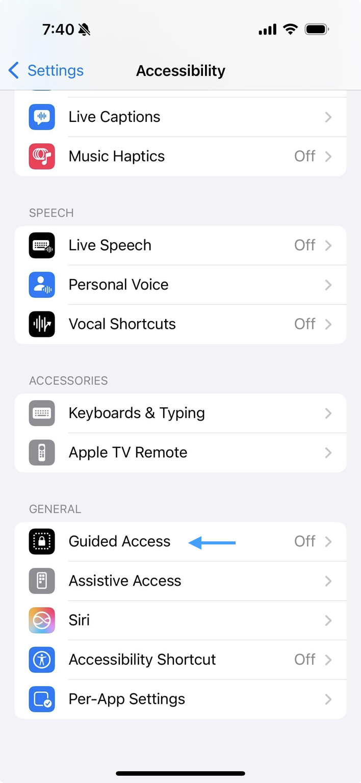 iPhone's Accessibility menu with an arrow pointing to Guided Access.