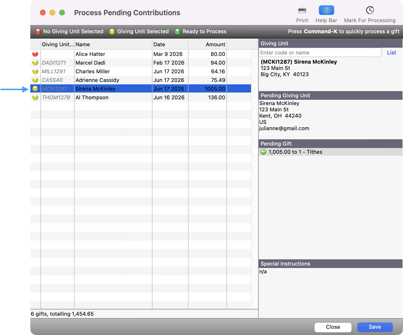 Process Pending Contributions window with an arrow pointing to the yellow dot next to the contribution.